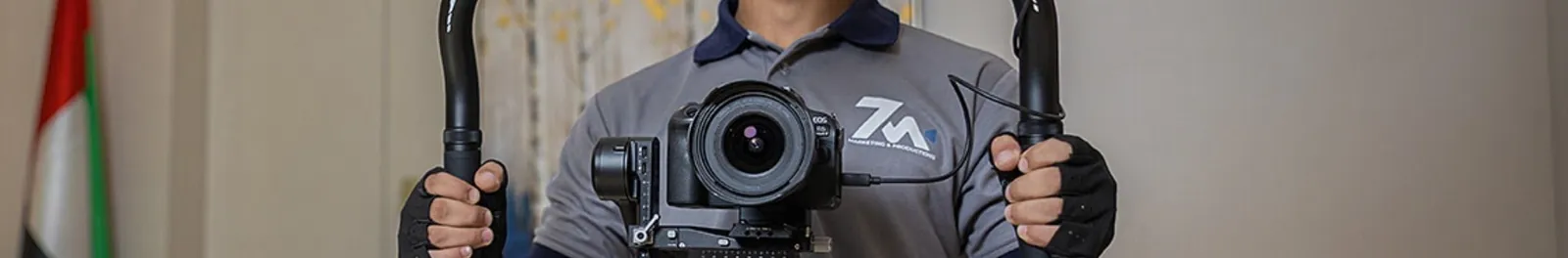 7M videographer filming with a camera gimbal